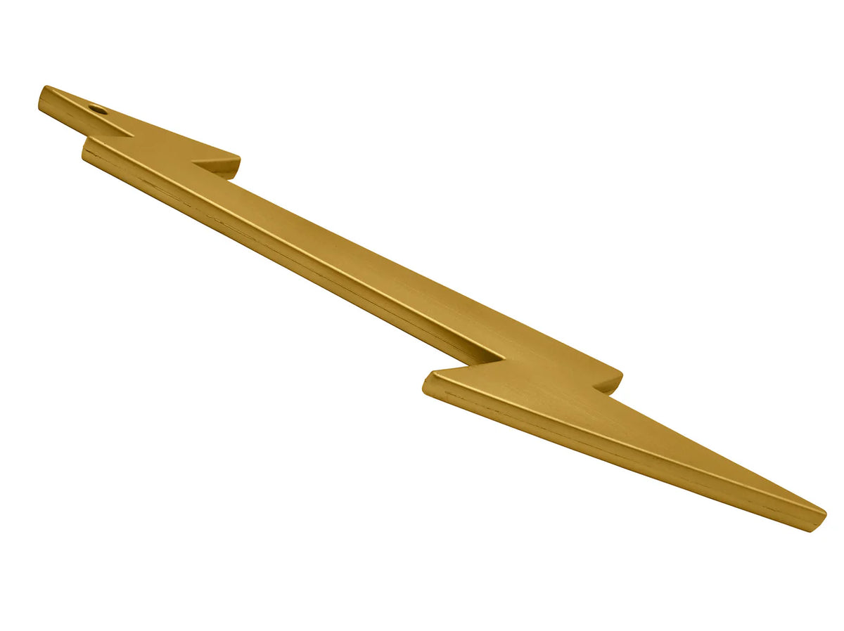 Gold lightning bolt prop flat lay — full 19.5" length with textured surface detail visible