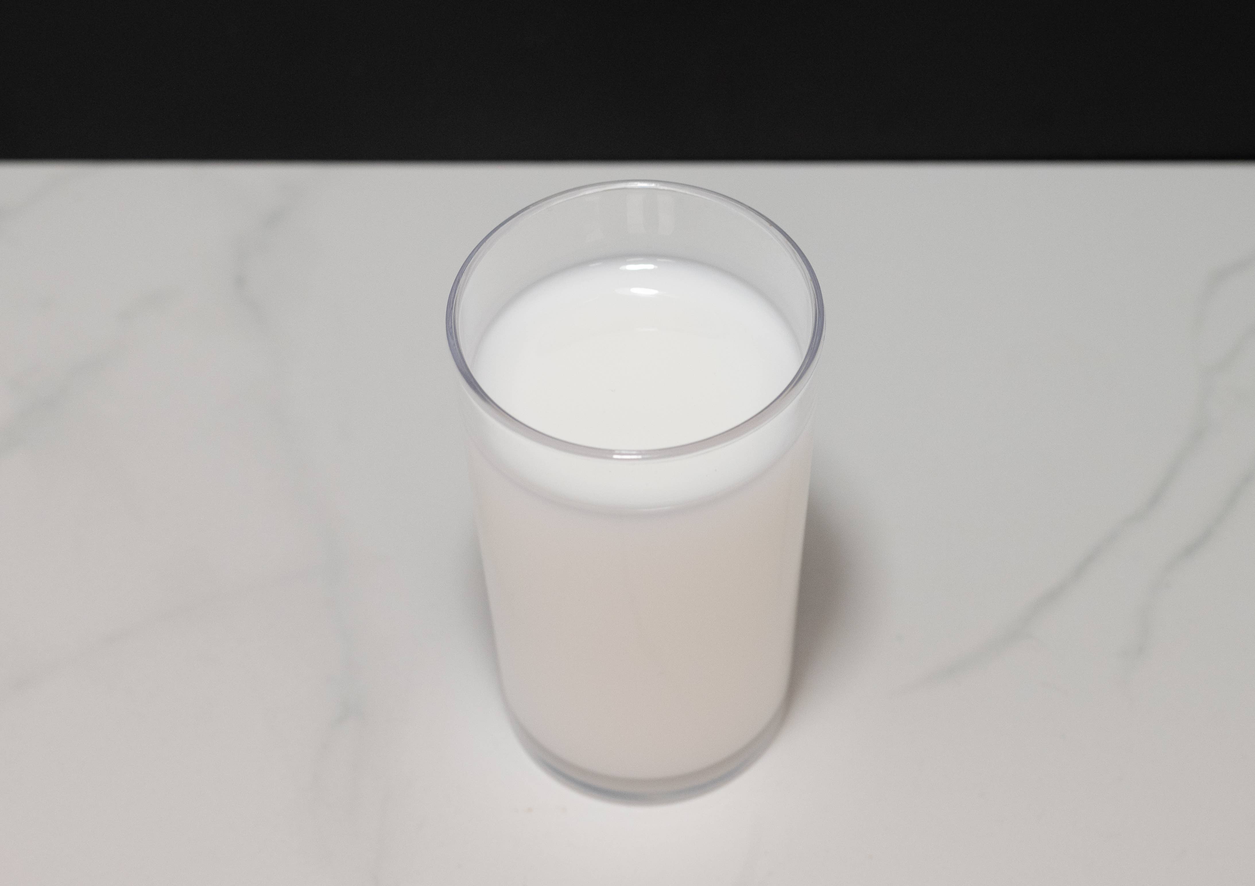 Fake glass of milk — top-down view showing surface detail