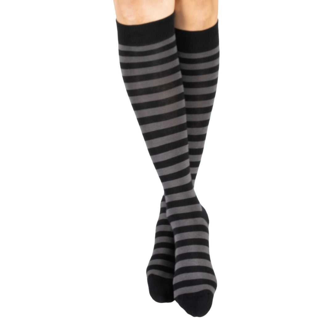 Smoke grey and black striped knee high socks — model standing, front view