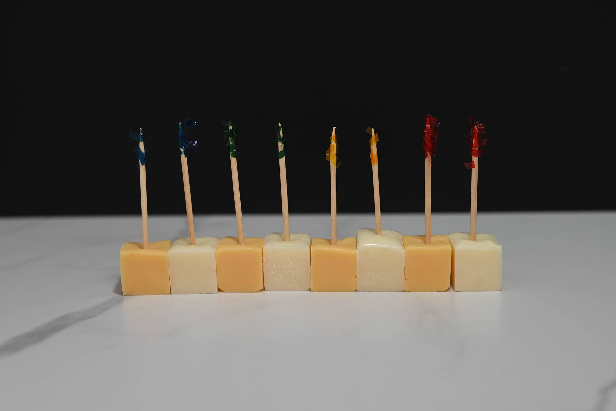 Fake cheddar cheese cubes styled on charcuterie board display