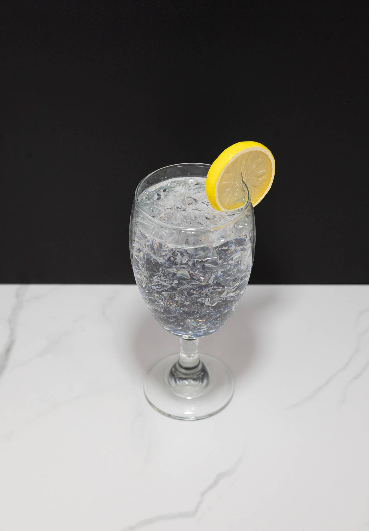 Fake iced water glass — styled alongside matching fake water pitcher display