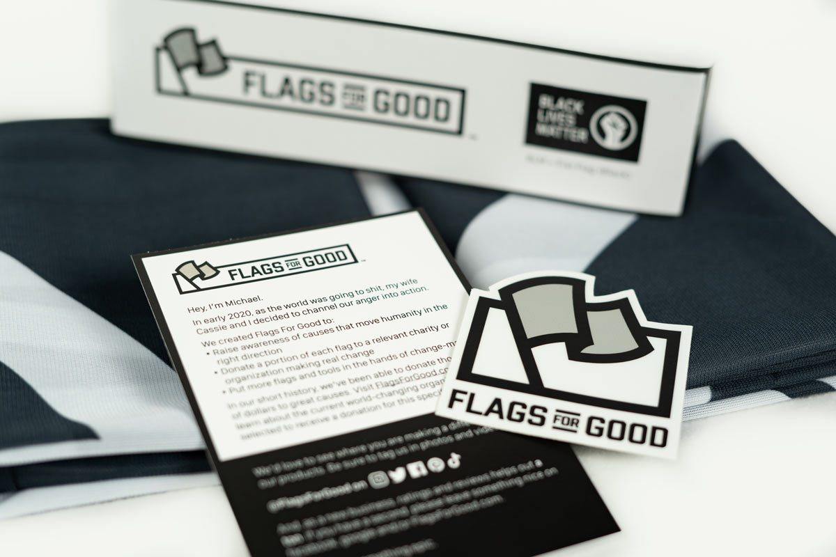 Black Lives Matter + Fist flag — unfolded flat lay showing full design