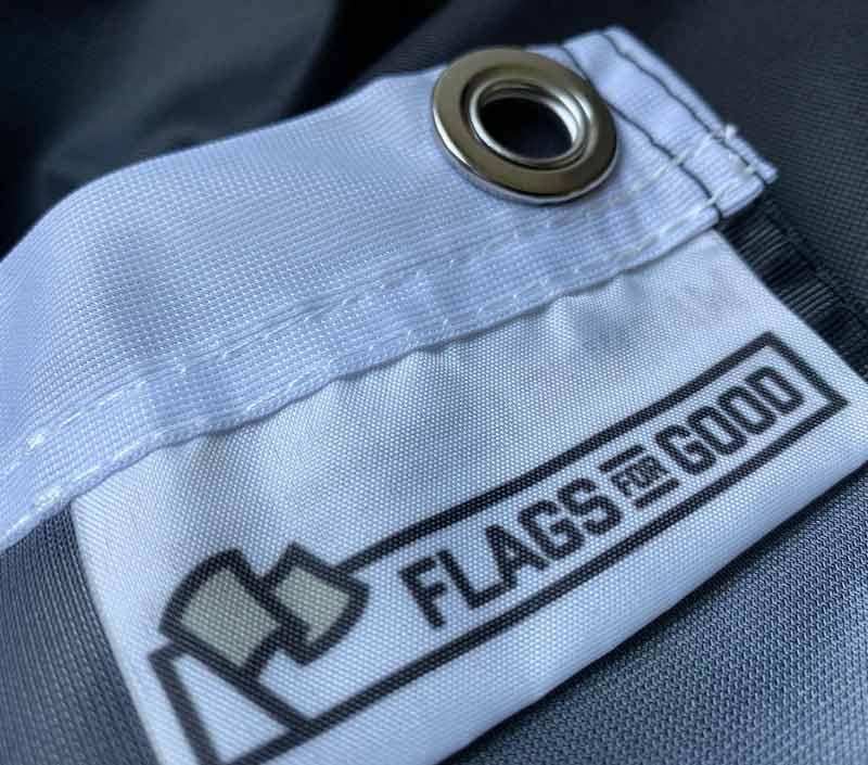 Flags For Good hangtag — black tag with branding detail