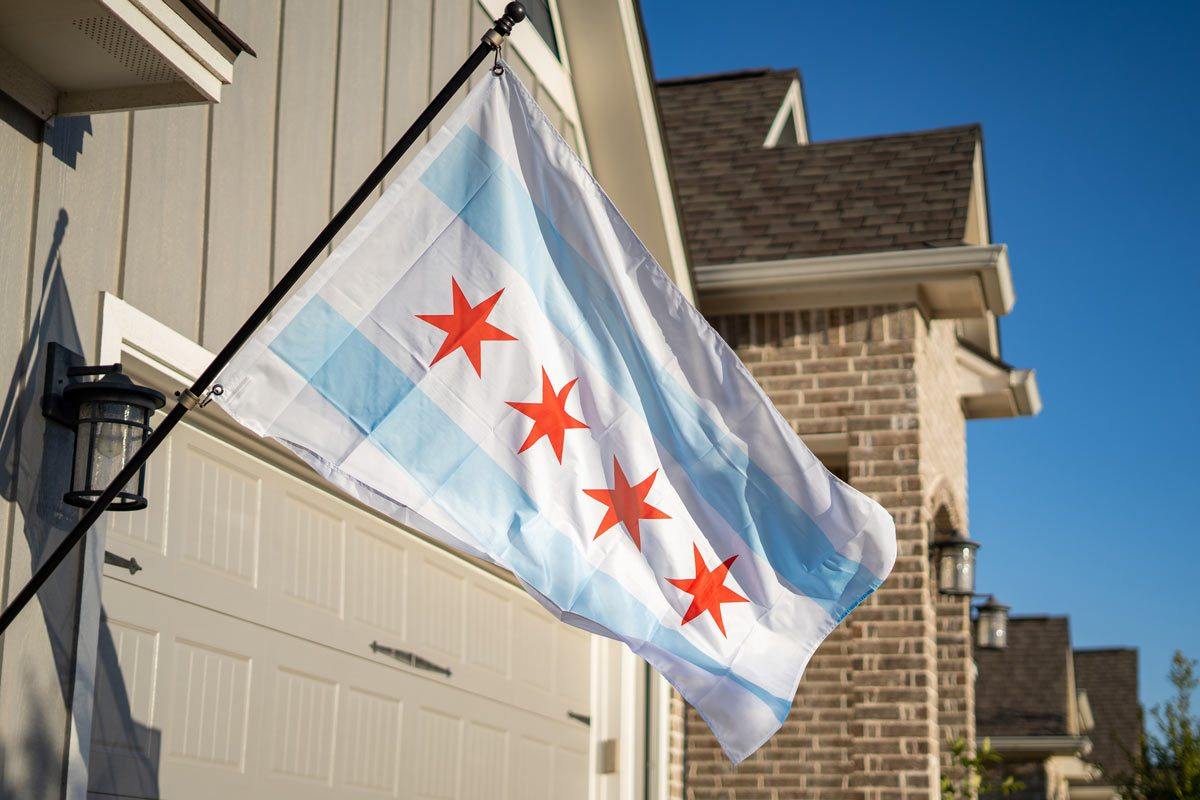 Chicago Flag flying on a flagpole against open sky