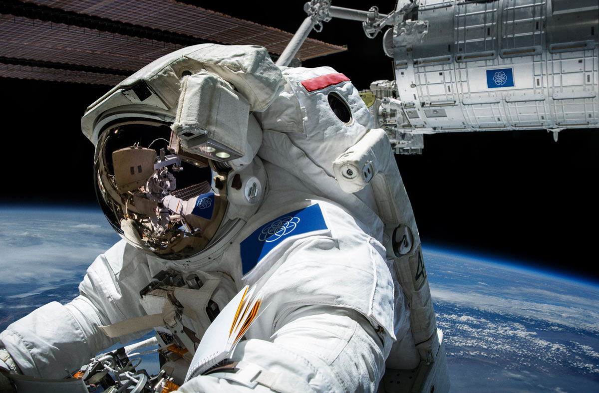 Earth Flag displayed outdoors with person in astronaut costume
