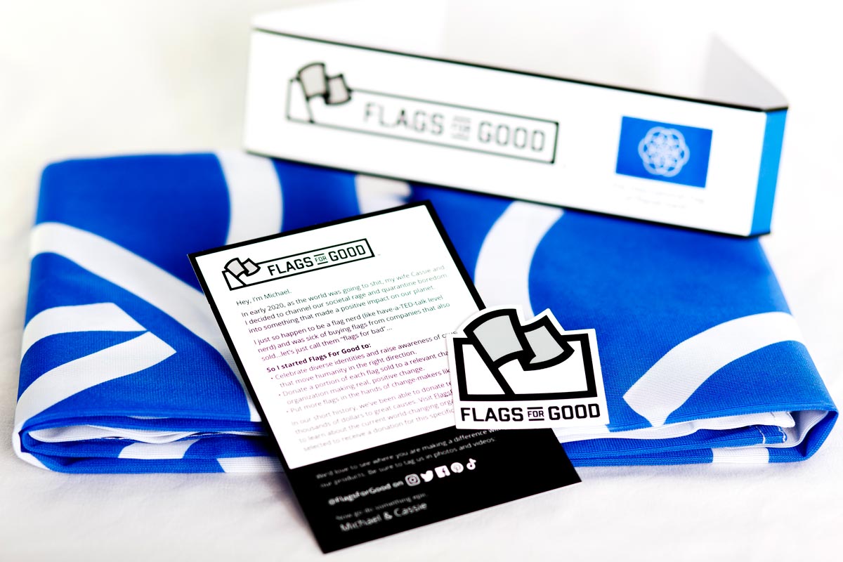 Earth Flag unfolded flat lay showing full seven-ring flower design