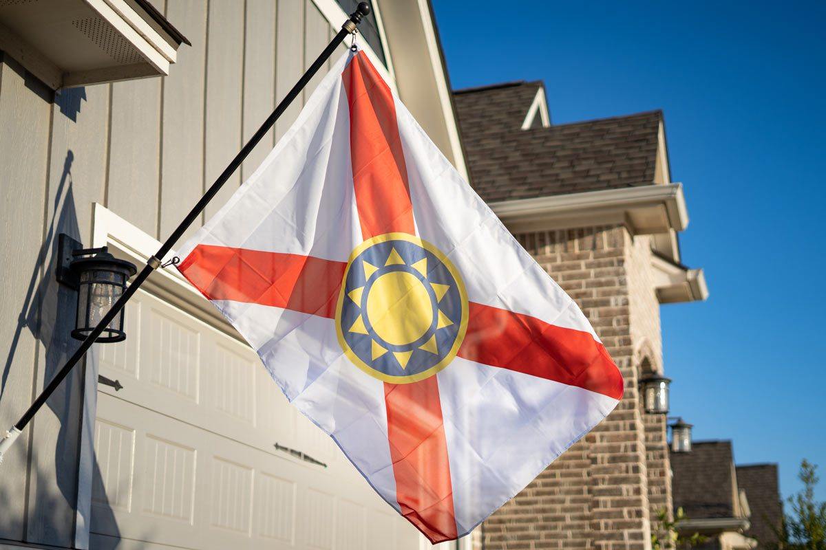 Florida Sunshine Flag — flying on a flagpole outdoors