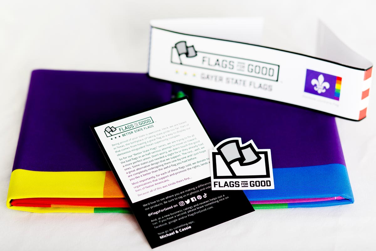 Rainbow Louisiana flag — fully unfolded, showing complete rainbow fly edge design
