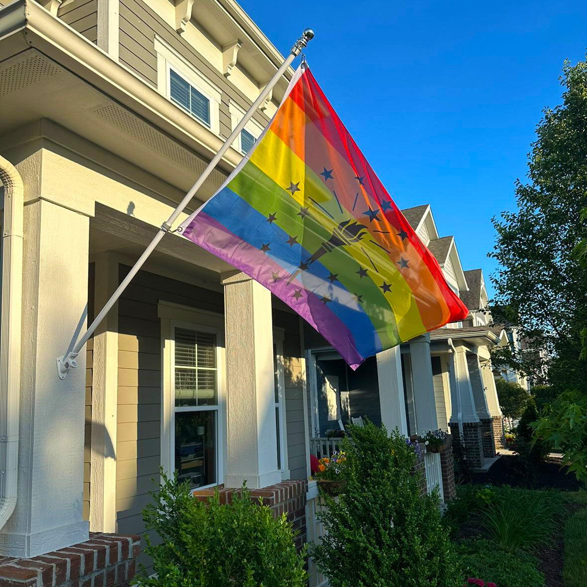 Indiana Rainbow Pride Flag displayed outside a home