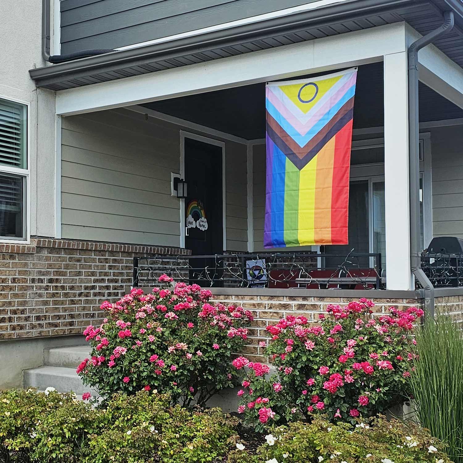 Intersex Progress Pride Flag hanging on a flagpole outdoors