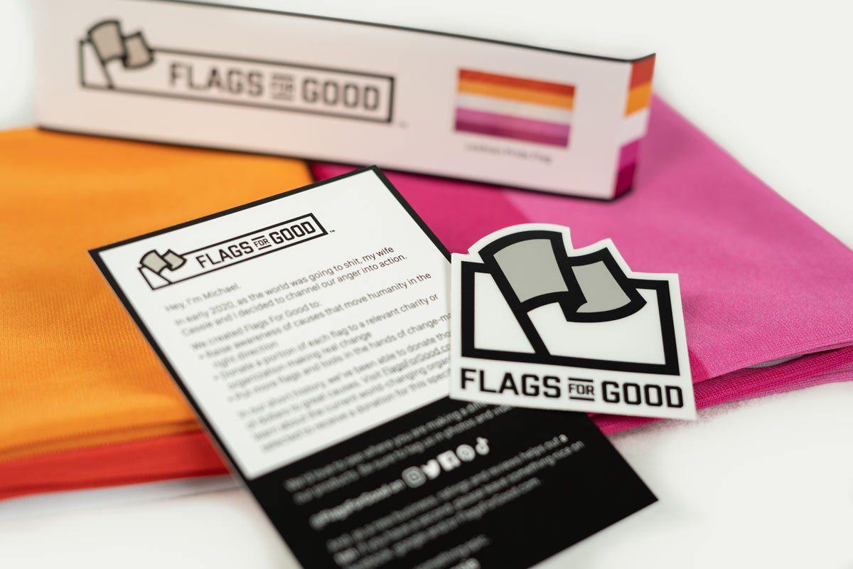 Lesbian Pride flag unfolded flat, showing full 5-stripe sunset design