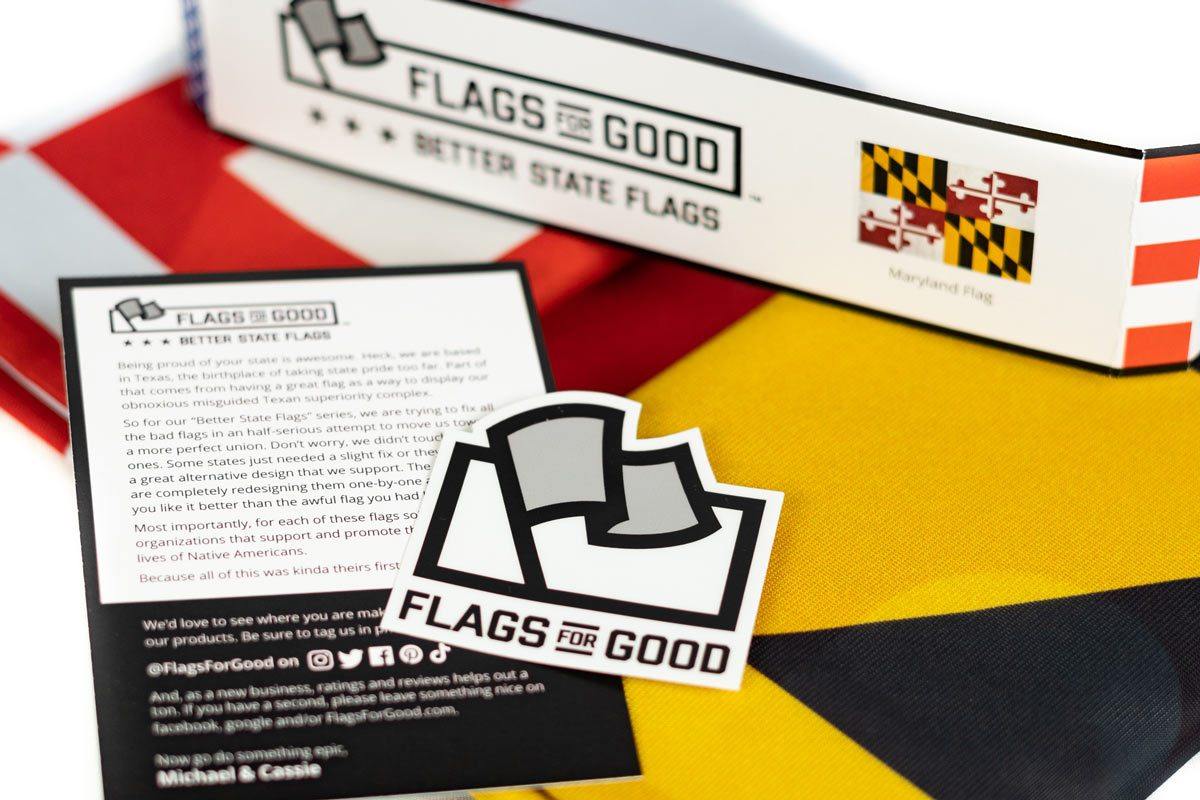 Maryland flag unfolded flat — full view of black, gold, red, and white quartered design