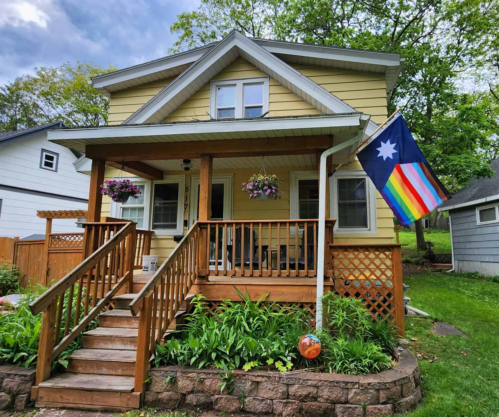 New Minnesota LGBTQ Pride Flag displayed on a house exterior