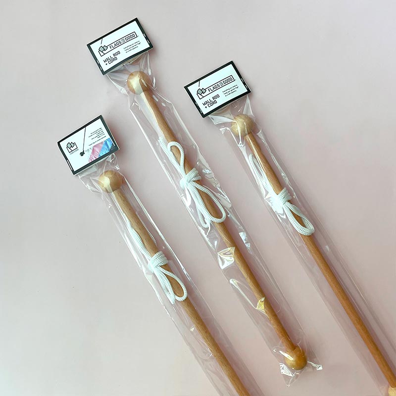 Natural wood wall rod with white cord — packaged, showing ball-end detail