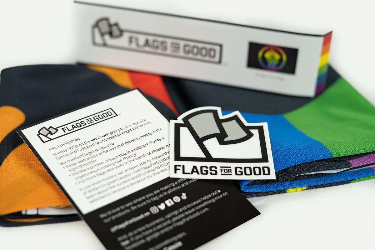 Rainbow Pride Fist flag — unfolded flat lay showing full design