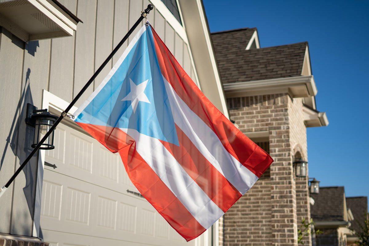 Puerto Rico light blue flag flying on a flagpole