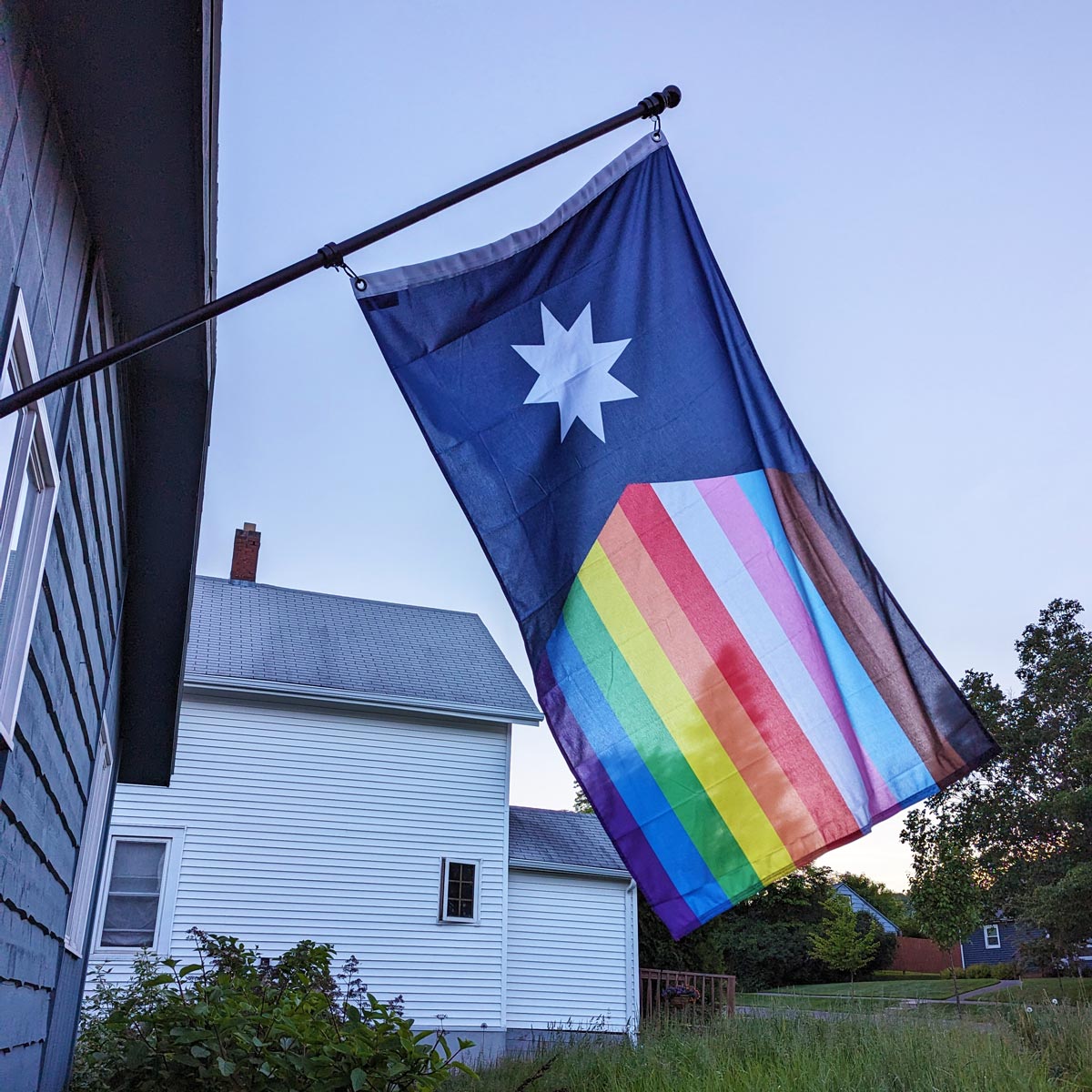 New Minnesota LGBTQ Pride Flag flying outdoors