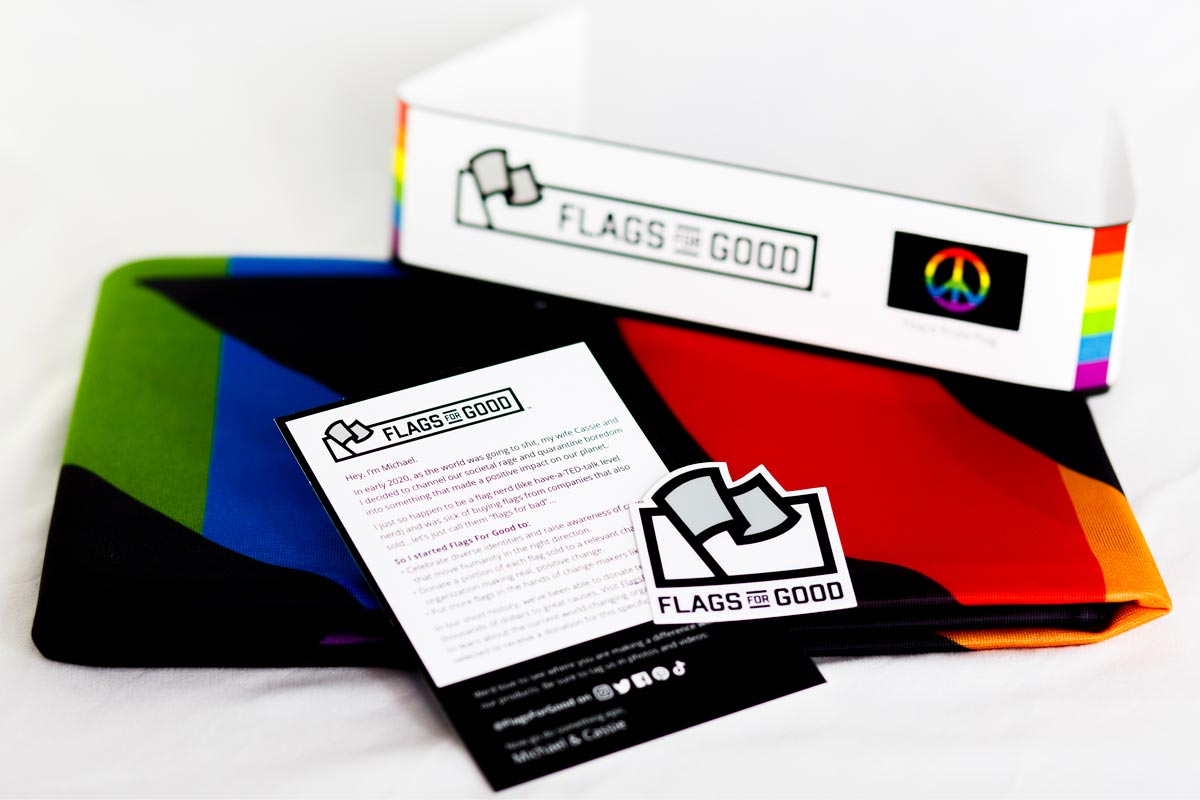 Rainbow peace sign flag — fully unfolded, showing complete rainbow peace symbol