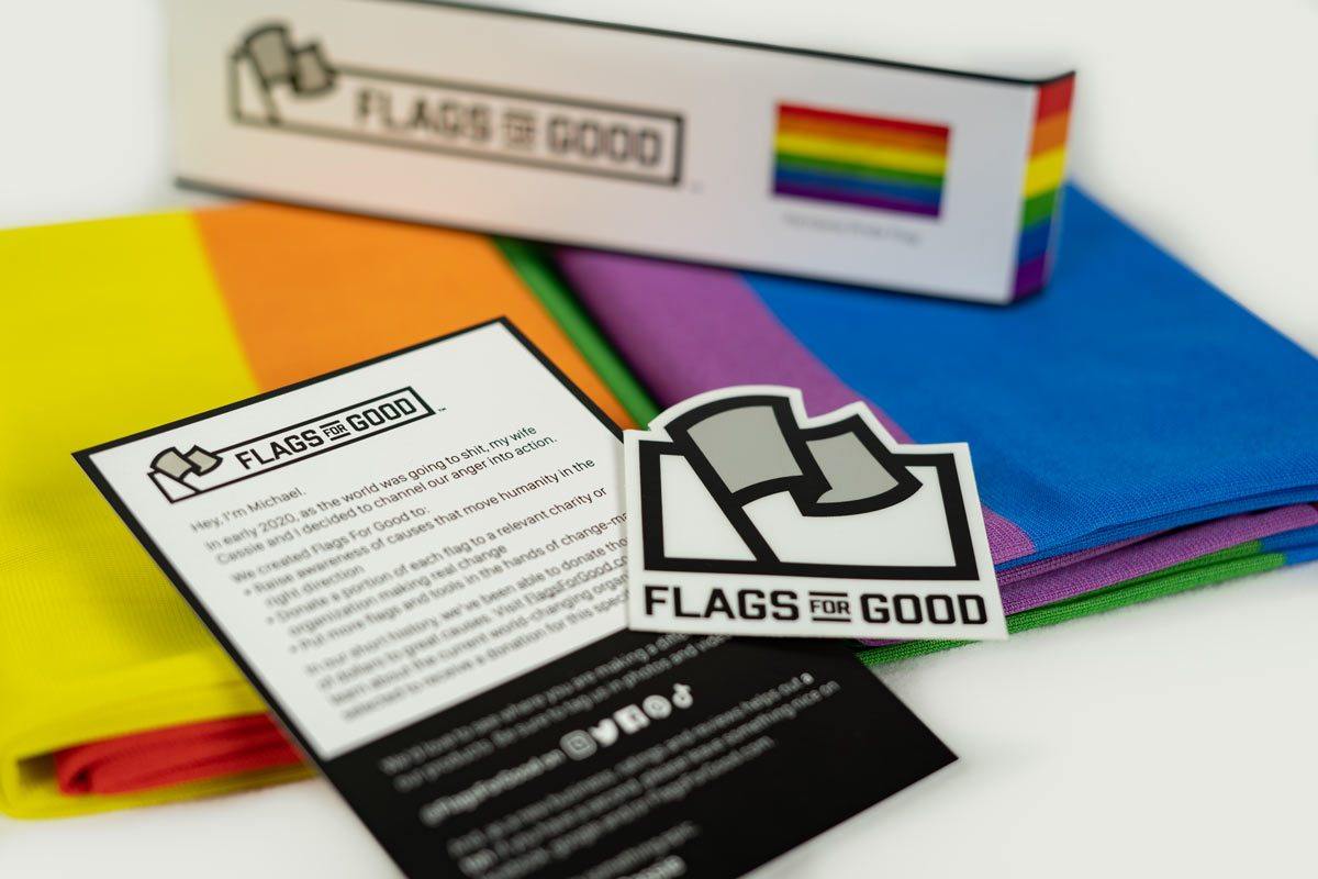 Rainbow Pride flag — unfolded flat lay showing full six-stripe design