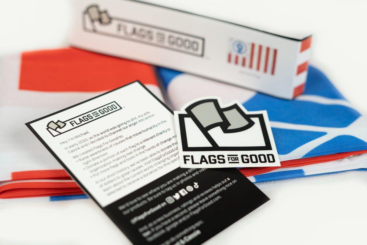 Resist flag — unfolded flat lay showing full civil-flag-inspired design