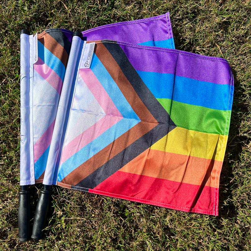 Progress Pride referee flag — open flat view showing double-stitched edges and pocket