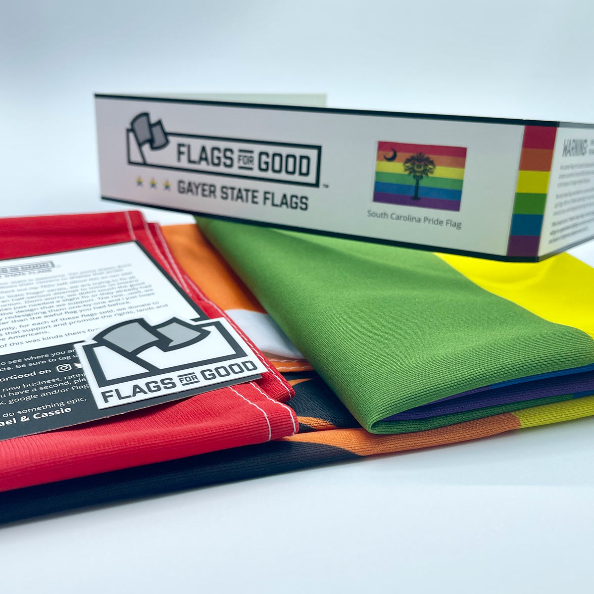 South Carolina Pride flag — unfolded flat lay showing full rainbow palmetto design