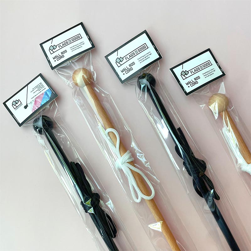 Hanging wooden wall rod and cord — black and natural wood variants shown side by side in packaging