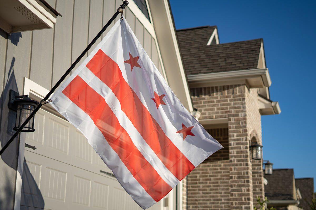 Washington DC flag flying on a flagpole outdoors