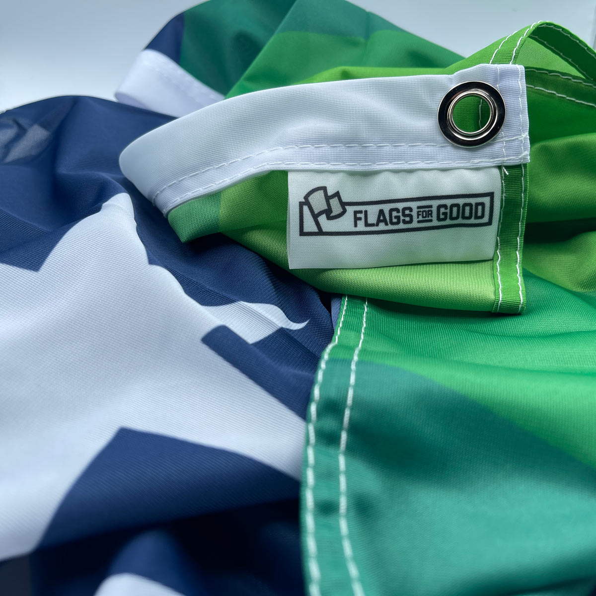 Washington State flag redesign — close-up of product tag and edge stitching