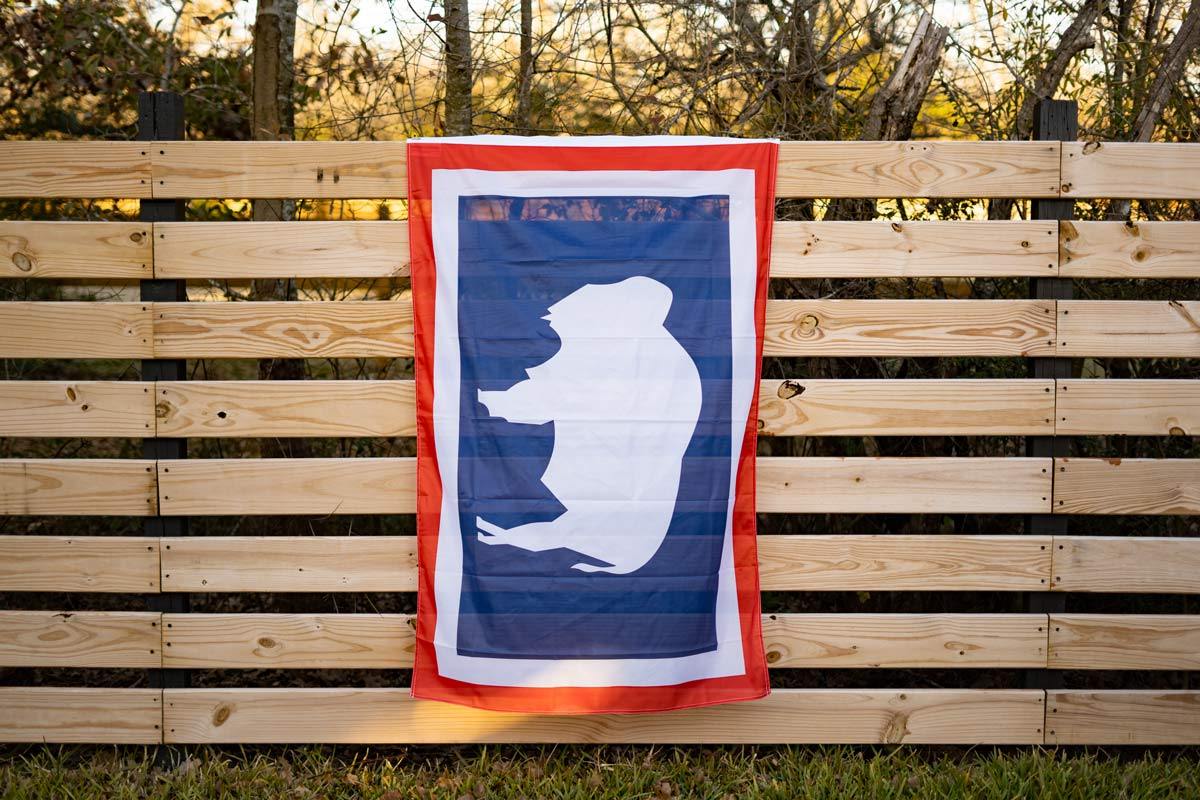 Wyoming flag displayed on an outdoor fence