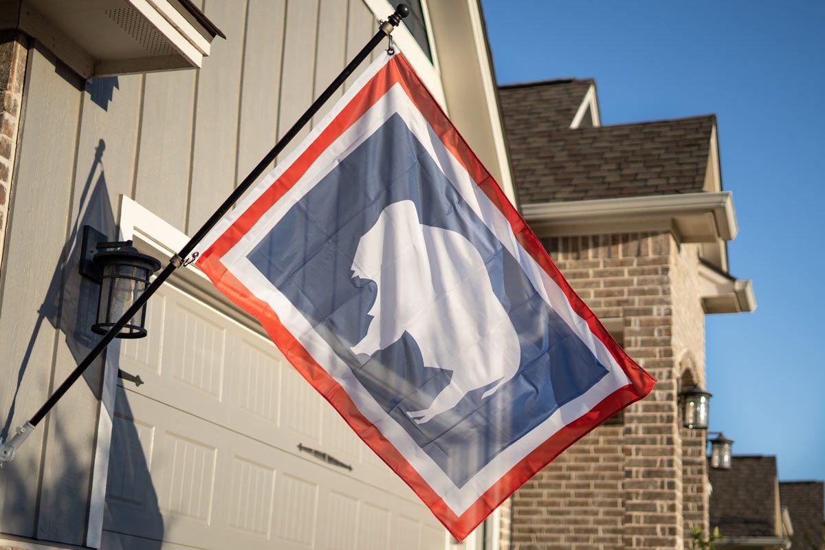 Wyoming flag flying on a flagpole outdoors