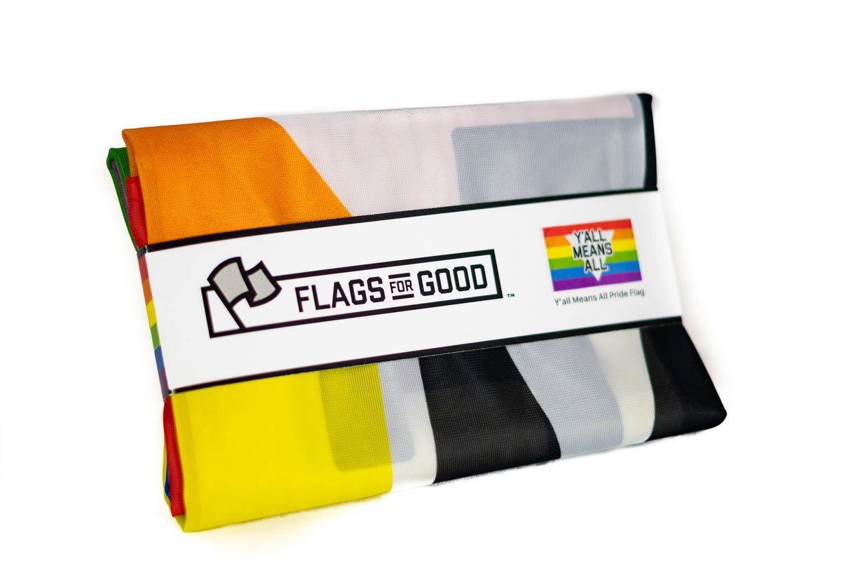 Y'all Means All rainbow flag folded, showing edge stitching
