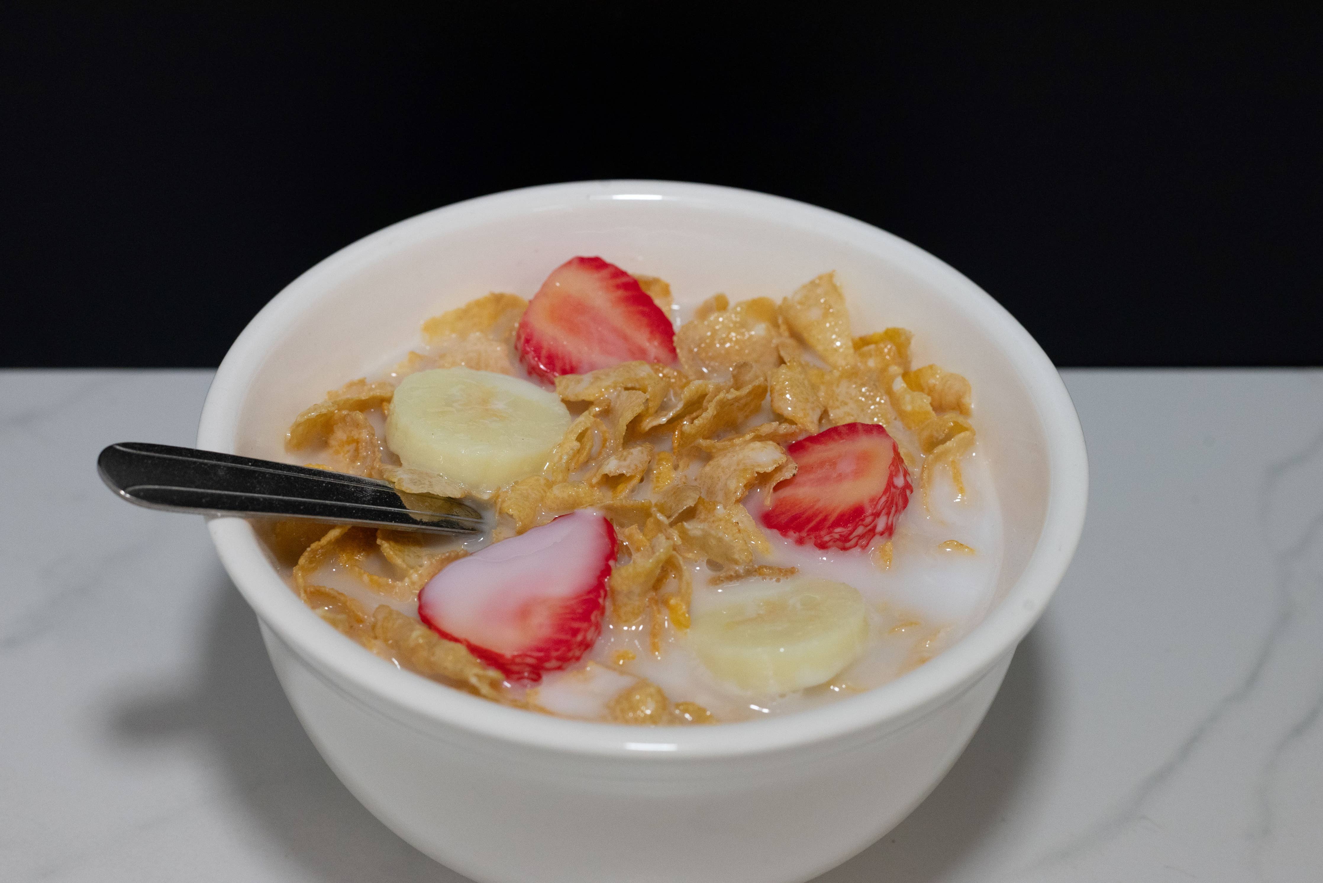 Cereal Bowl of Cornflakes with Fake Strawberries and Bananas
