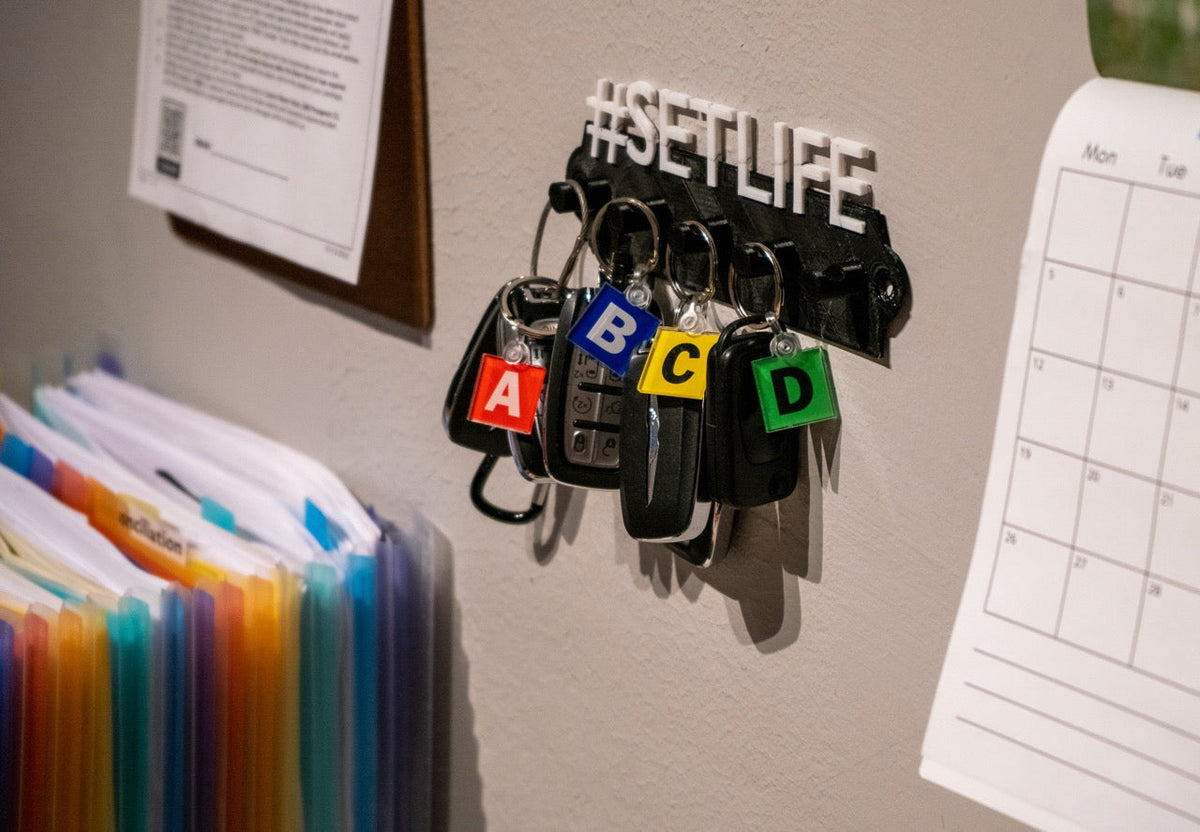 Last Look Labels production vehicle keychains — labeled key fobs shown clipped to keys