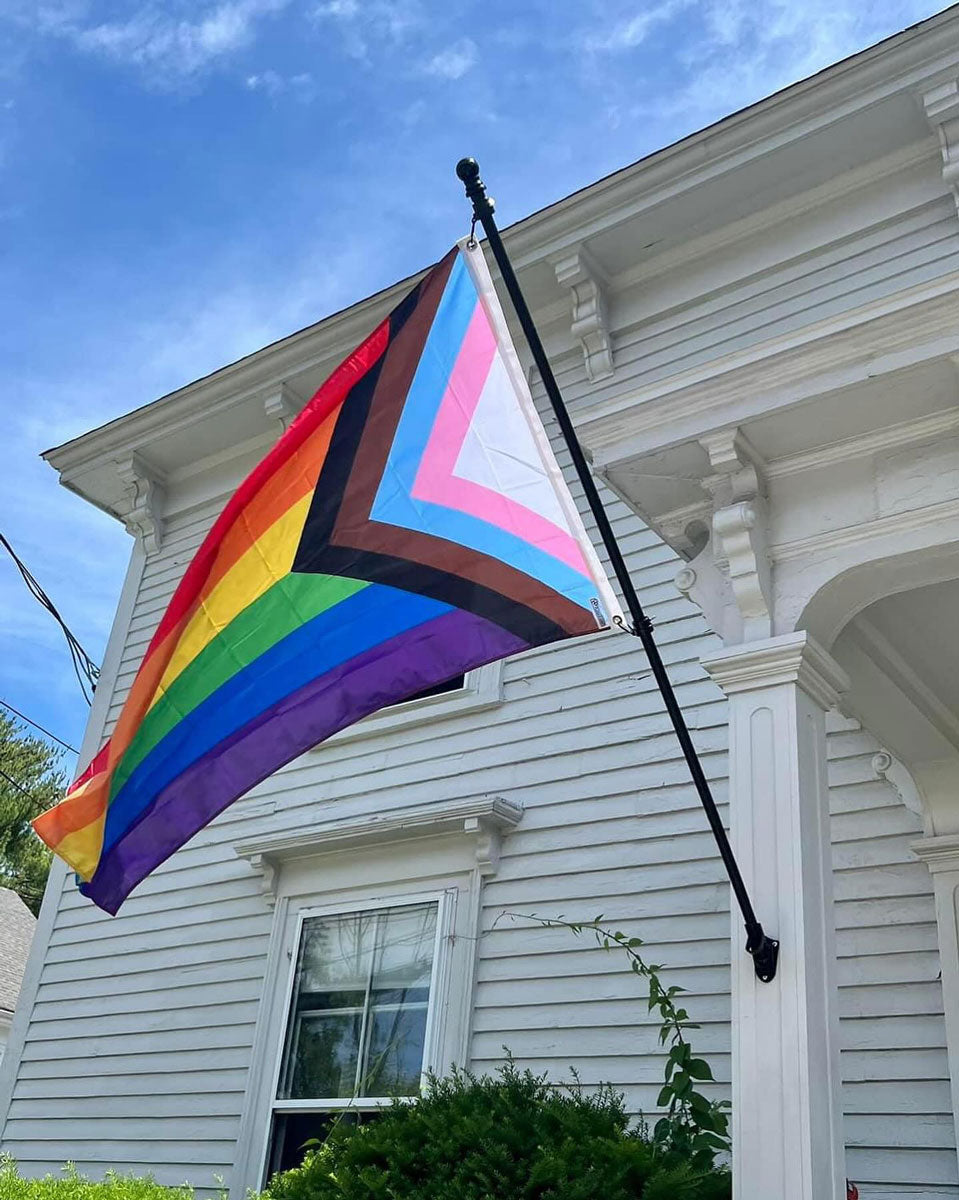 Progress Pride Flag displayed on the exterior of a home