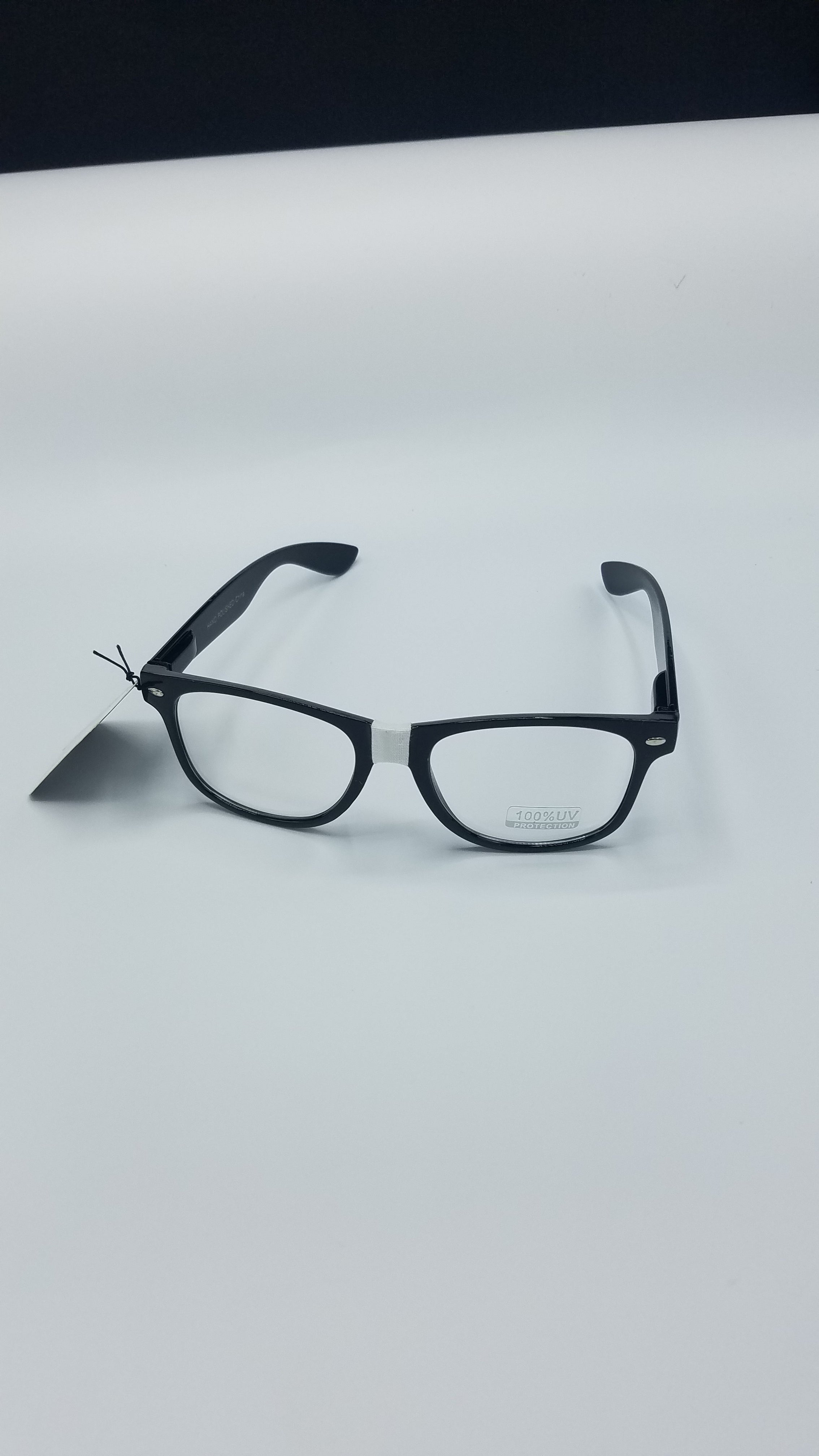 Nerd glasses worn on face — showing fit and taped nose bridge detail