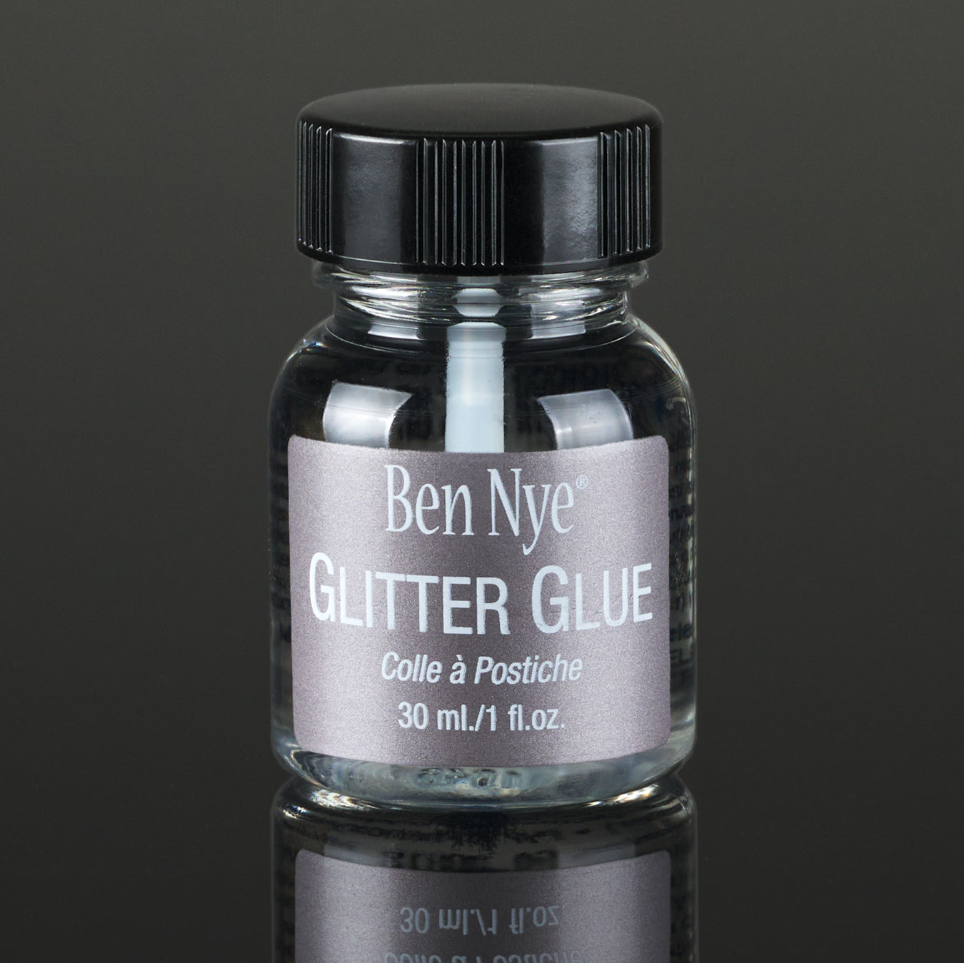 Ben Nye AGB Glitter Glue applied with black glitter on skin, showing finish