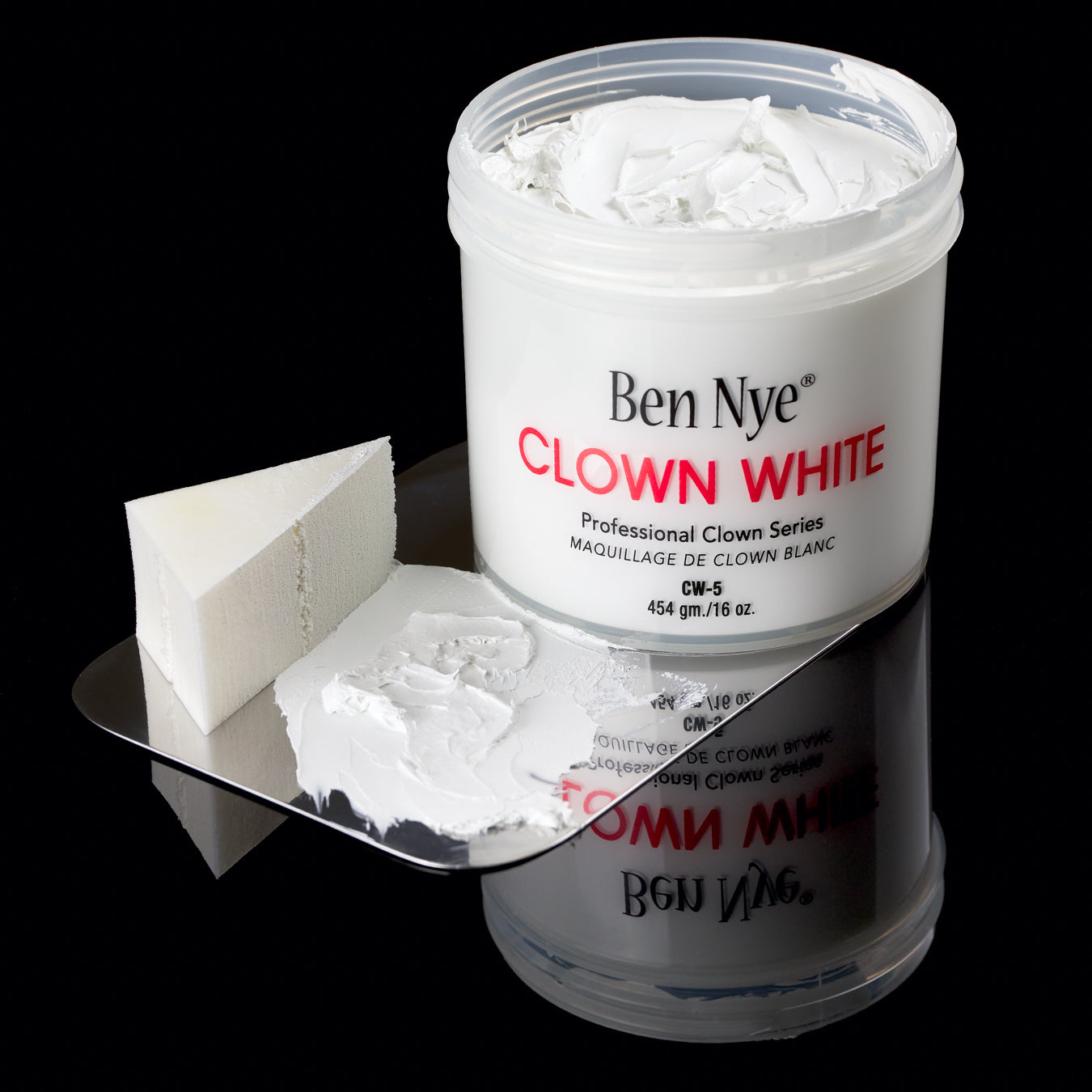 Ben Nye Clown White applied with sponge — demonstrating coverage over dark background
