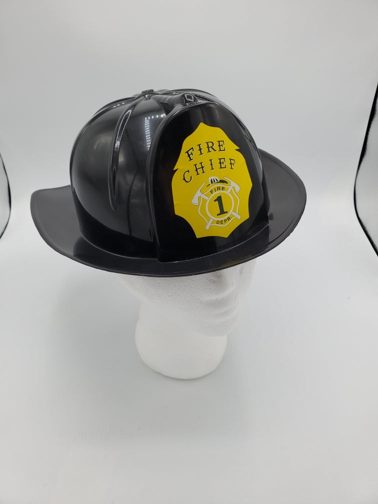 Black plastic adult fireman helmet — one size fits most, fire chief sticker attached