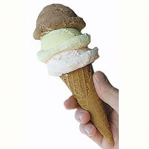 Realistic ice cream scoop with cone, three flavors