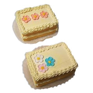 Petit four cake stage prop — polyfoam, 2"×3", decorated with flowers and frosting trim