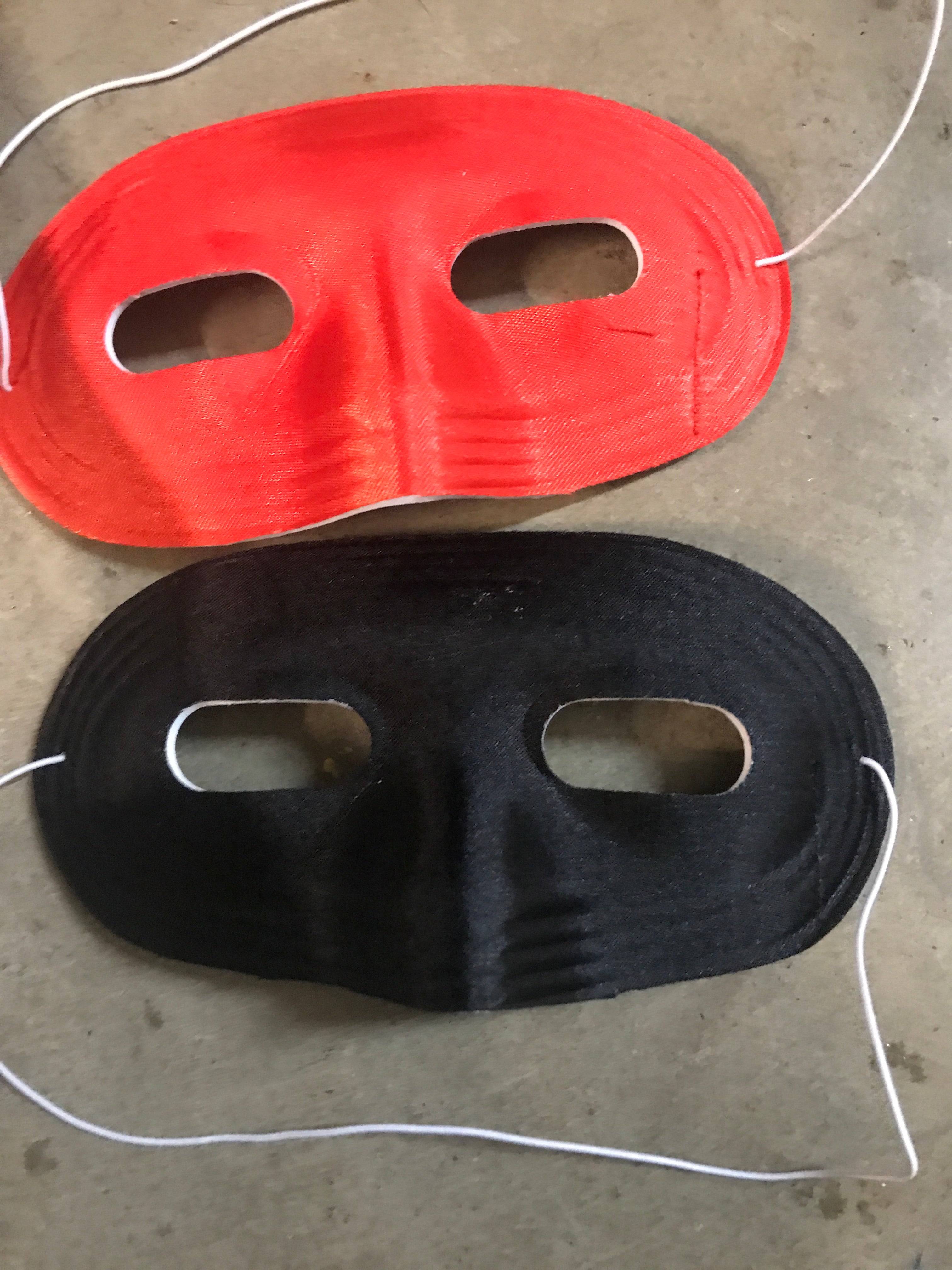 Domino half mask — side or alternate view showing satin finish and elastic fastener