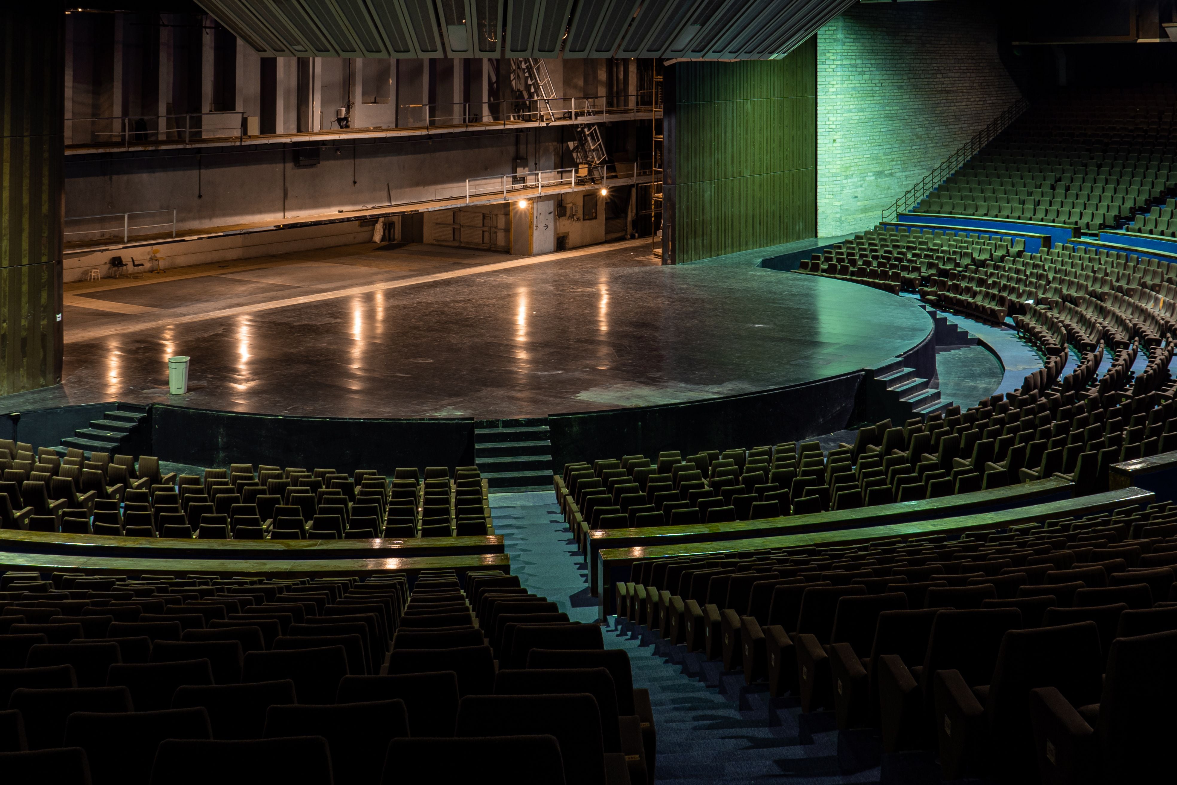 Empty theatre stage with dramatic green lighting — Wicked production supplies