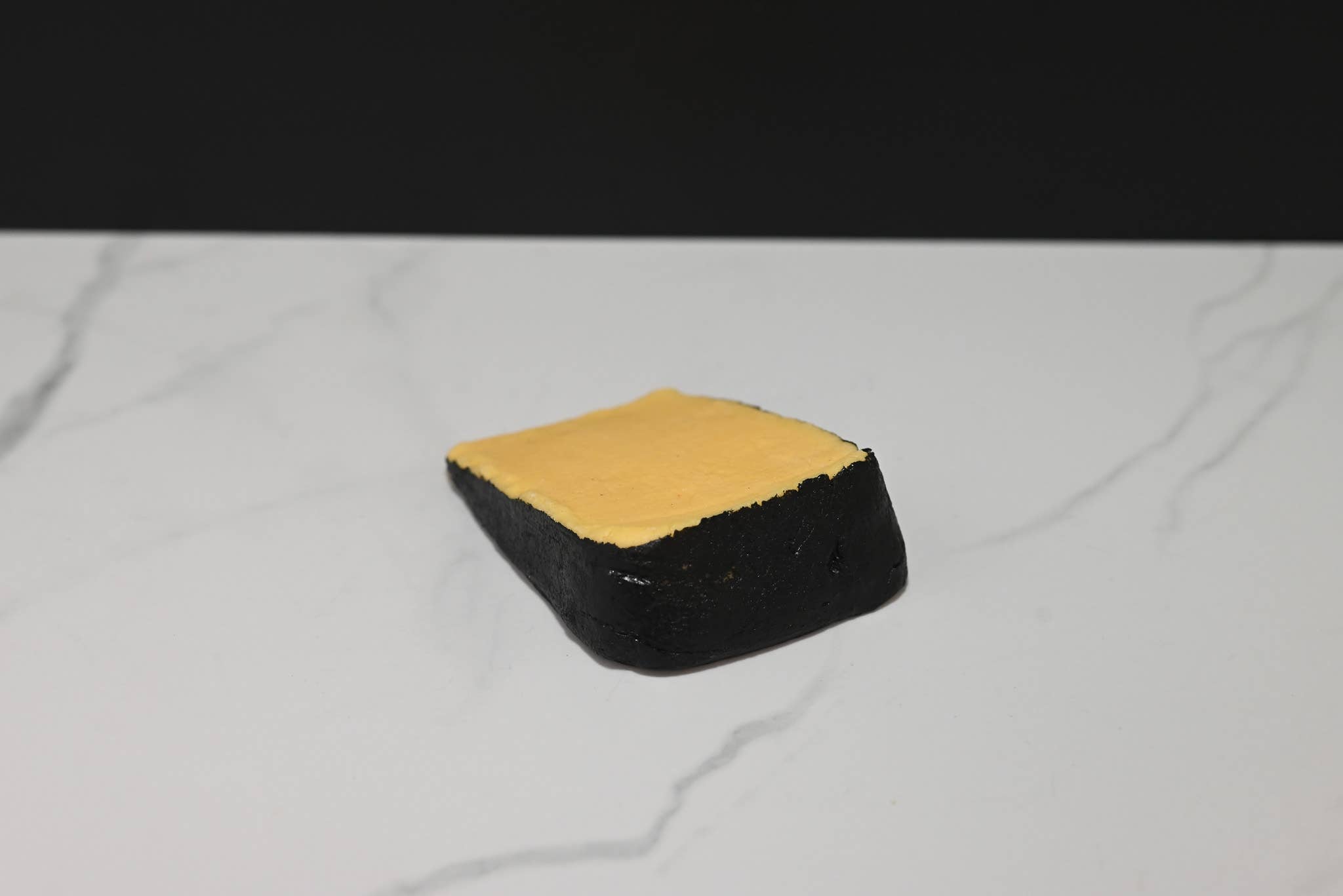 Fake Cheddar Cheese Wedge with Black Rind