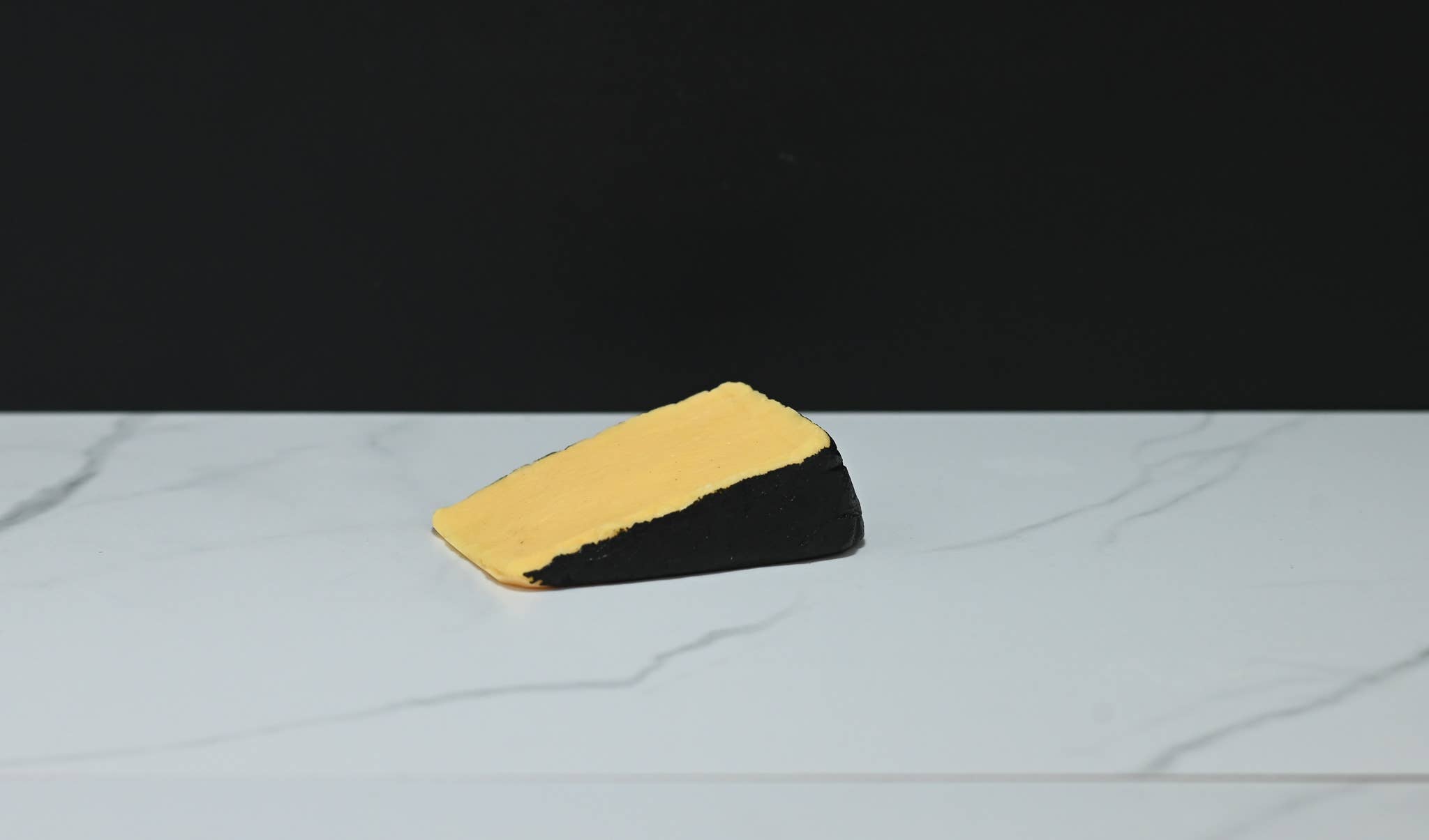 Fake Cheddar Cheese Wedge with Black Rind