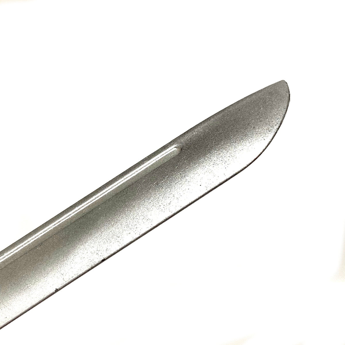 Rubber knife prop — side profile showing blade thickness and silver finish