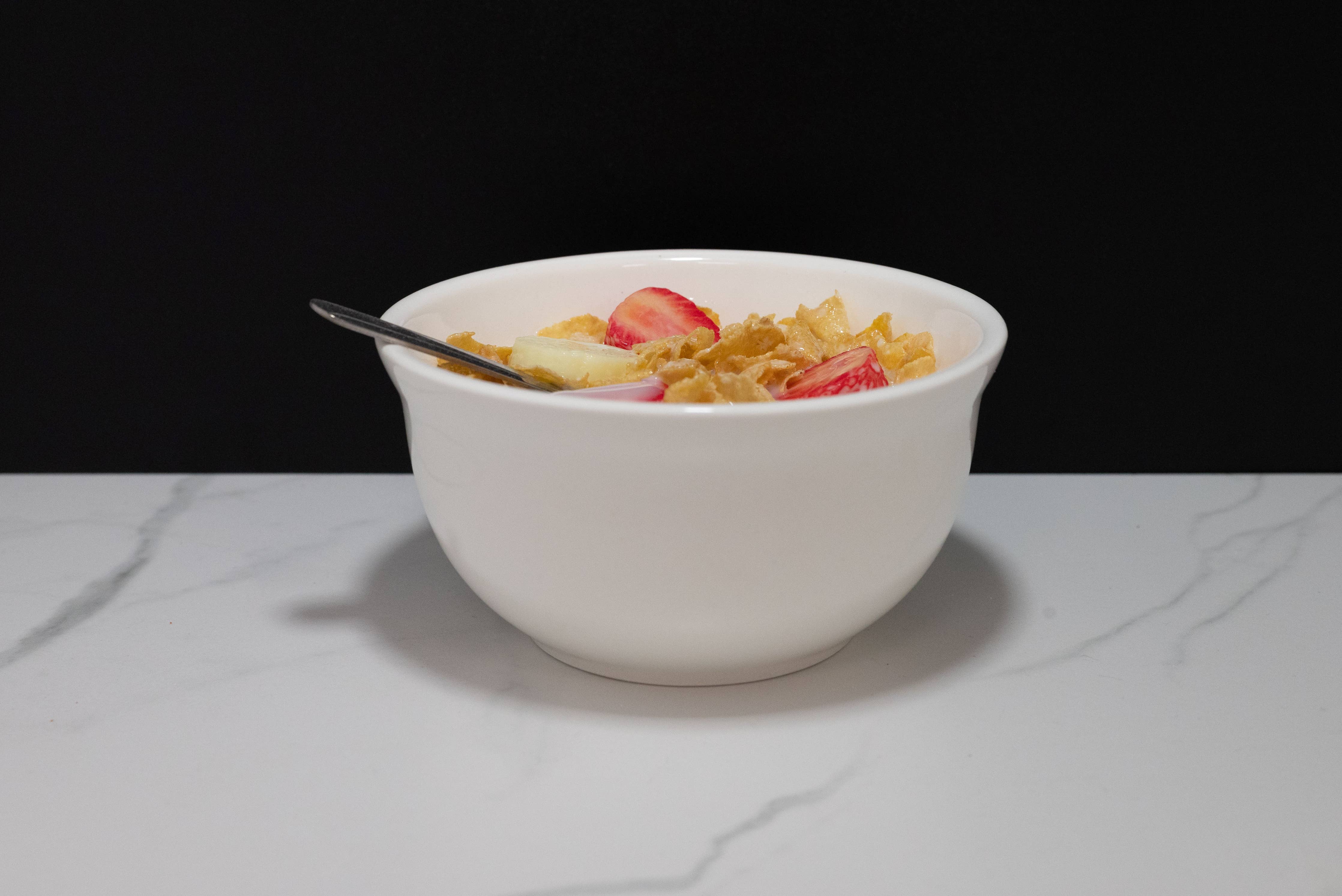 Cereal Bowl of Cornflakes with Fake Strawberries and Bananas